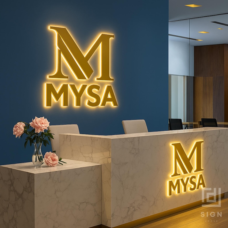 May include: A modern office reception area featuring a marble-patterned desk and a blue wall. The wall displays a glowing gold "M MYSA" logo. A vase of pink roses sits on the desk, adding a touch of color to the professional setting.