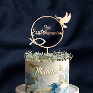 Goldener Tortenstecker zur Erstkommunion aus Acryl mit rundem Rahmen, Taube, christlichem Fischsymbol und Schriftzug – elegante Kommuniondeko für Mädchen und Jungen.