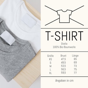 May include: Two t-shirts, one white and one gray, are neatly folded on a wooden surface. The image includes a graphic with the word "T-SHIRT" and size information in centimeters. The shirts are made of 100% organic cotton.