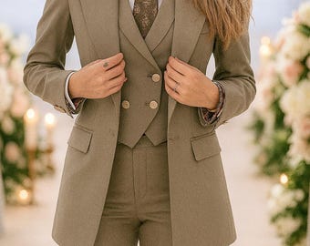 May include: An olive green three-piece suit, comprising a blazer, waistcoat, and trousers, paired with a patterned tie and a white collared shirt. The blazer has two pockets and a double-breasted design. The tie displays a delicate pattern.