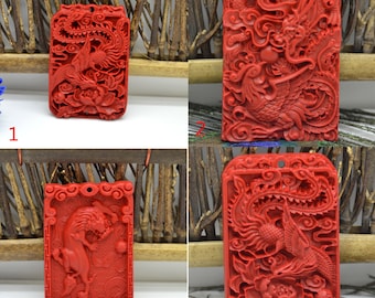May include: Four red jade pendants with intricate carvings of dragons and phoenixes. The pendants are rectangular and have a hole at the top for hanging.