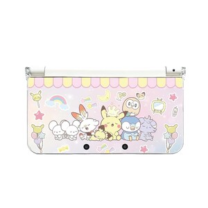 May include: A Nintendo 3DS console featuring a colorful design with cartoon characters. The design includes a pink and yellow awning, a rainbow, stars, and various cartoon figures. The console is white and clear.