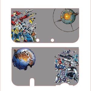 May include: A gray, rectangular case featuring colorful illustrations of Transformers characters and a planet. The case has a red outline and two circular cutouts. The design includes robots and space-themed elements.