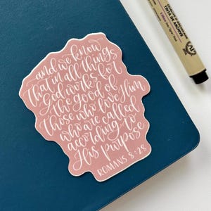 Romans 8:28 Bible verse sticker in dusty pink | Christian faith encouraging scripture