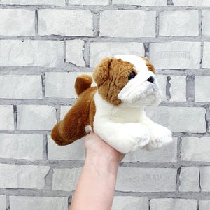 May include: A set of three ceramic mugs with a speckled, matte finish. The mugs are in shades of cream, light gray, and dark gray. Each mug has a simple, minimalist design, perfect for coffee or tea.