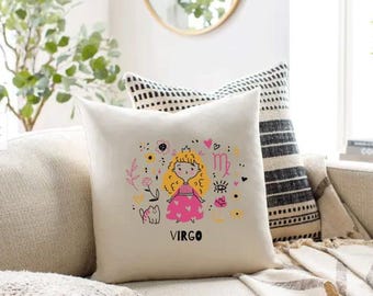 May include: A square, off-white throw pillow with a colorful Virgo design. The illustration features a cartoon girl in a pink dress, surrounded by flowers, hearts, and the Virgo symbol. The word "VIRGO" is printed below the illustration.