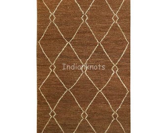May include: Brown rectangular rug with a diamond pattern in off-white. The rug has a textured appearance and the text "Indianknots" is visible. This rug is suitable for living rooms, bedrooms, or entryways.