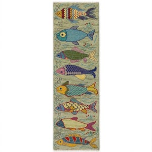 May include: A rectangular runner rug with a light green background featuring eight distinct fish arranged in a vertical column. Each fish displays a unique pattern and color combination, including shades of red, blue, yellow, and purple.