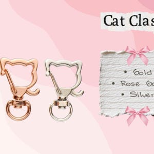 May include: Three cat-shaped clasps in gold, rose gold, and silver. The clasps have a swivel base and a ring for attaching to items. Text on a paper reads "Cat Clasp" and lists the colors: Gold, Rose Gold, and Silver.