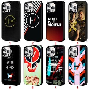 May include: A collection of eight black phone cases with various designs. The cases feature text and graphics, including the words "Quiet is Violent," "Stay Alive," and the band name "Twenty One Pilots."