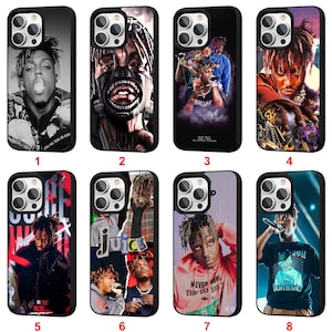 May include: Collection of eight black phone cases featuring images of a musician. The cases display various portraits and graphic designs, including the text "ONE" and "ONE HELL TEAR US APA".