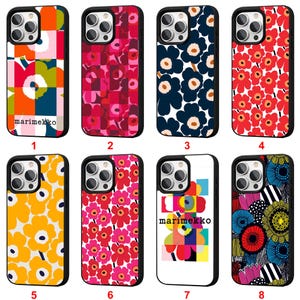 May include: Eight phone cases with diverse floral and geometric patterns. The cases have a black border and a range of colours, including red, pink, yellow, blue, and white. Some cases display the "marimekko" logo.