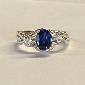 Ladies Gold or Sterling Silver 4 Band Puzzle Ring set with Faceted, Oval Synthetic Sapphire