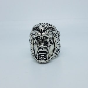 May include: A silver ring with a detailed design of a snarling jaguar head.