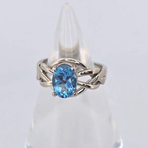 Ladies&#39; Blue Topaz Sterling Silver, Gold, or Platinum 4 Band Puzzle Ring 4BT