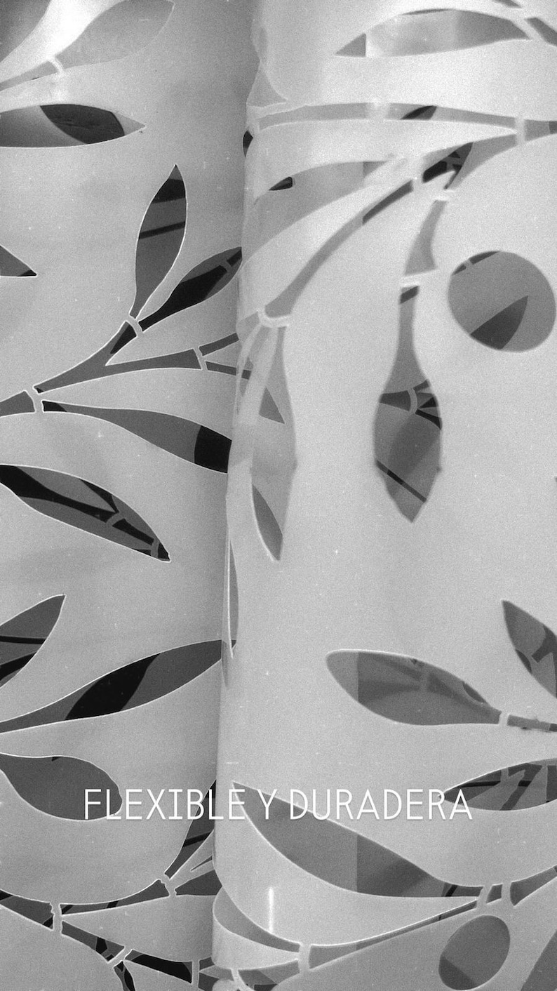 May include: A light-colored, flexible sheet featuring a repeating laser-cut pattern of elongated leaves and stems. The surface is smooth and semi-translucent. The text FLEXIBLE Y DURADERA is printed in white on the lower portion of the sheet.