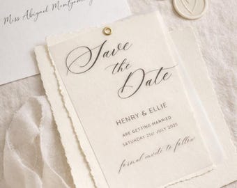 May include: Elegant wedding stationery set featuring a translucent "Save the Date" card with gold grommet, layered over textured paper. The card includes the names "Henry & Ellie" and the wedding date, July 21st, 2025. Includes an envelope and wax seals.