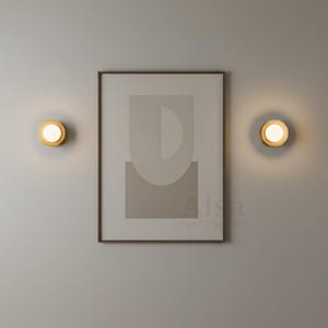 Modern gold wall lamp with globe design for minimalist bedroom lighting