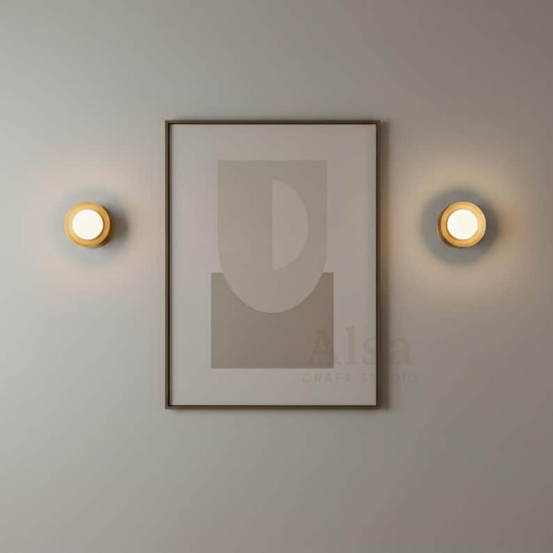 Modern gold wall lamp with globe design for minimalist bedroom lighting