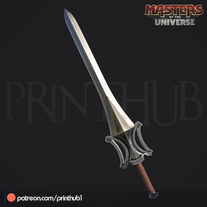 May include: A silver and bronze sword with a brown handle. The sword has a wide, flat blade and a detailed hilt. The "Masters of the Universe" logo is visible in the top right corner. The sword is set against a dark background.