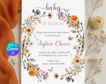 May include: A baby shower invitation with a floral wreath design. The invitation features the text "baby IN BLOOM" and details for Sylvie Clover's baby shower, including the date, time, and location. The design includes butterflies and a watercolor floral border.