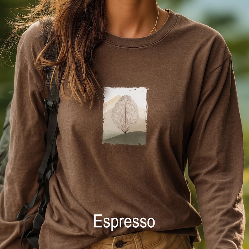 May include: Espresso-colored long-sleeve shirt with a rectangular graphic of a leaf and mountain landscape. The shirt is a solid brown color with the word "Espresso" printed at the bottom.