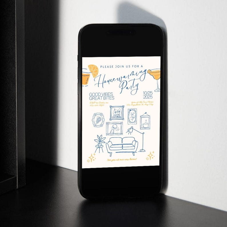 May include: A smartphone displays a housewarming party invitation. The design features illustrations of a cocktail, framed art, a sofa, and text that reads "Please join us for a Housewarming Party" with the date and location.
