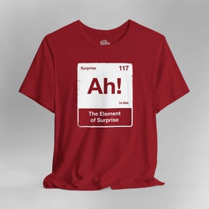 Camiseta "O Elemento Surpresa" - Presente para Fãs do Projeto Ave Maria - Camiseta Divertida com a Tabela Periódica - Camiseta com Humor para Professores de Ciências
