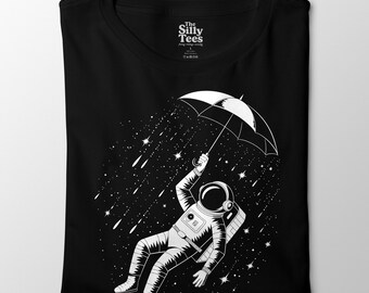 Chemise parapluie astronaute, t-shirt pluie spatiale, t-shirt graphique surréaliste sur l'espace, cadeau pour les amoureux de la galaxie