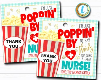 May include: Two printable gift tags with a popcorn bucket and a red heart with a plus sign. The text on the tags reads "I'm just poppin' by to say thanks for being a great nurse!" and "I'm just poppin' by".
