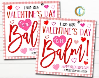 May include: Two printable Valentine's Day cards with a pink and white gingham background. The cards feature the text "I hope your Valentine's Day is the balm!" with red hearts and pink hearts. The first card says "Happy from" and the second card says "Happy Valentine's Day! From the Jackson Family."