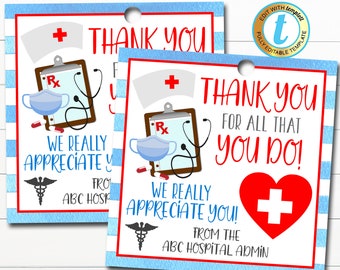 May include: Two blue and white striped thank you tags with a red heart, a stethoscope, a clipboard, and a face mask. The text on the tags reads "Thank you for all that you do! We really appreciate you! From the ABC Hospital Admin".
