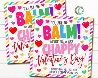 May include: Two colorful Valentine's Day cards with rainbow stripes and hearts. The text on the cards reads "You are the balm! Wishing you a very chappy Valentine's Day! Thanks for all you do! From the Cedarwood PTO."