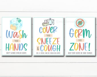 May include: Three colorful signs with illustrations and text promoting good hygiene practices. The first sign says "Wash Your Hands" with a hand washing illustration. The second sign says "Cover Your Sneeze & Cough" with an illustration of tissues and hand sanitizer. The third sign says "Germ Free Zone!" with an illustration of a red stop sign with a virus inside.