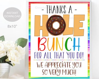 May include: A framed print with a colorful border and the words "THANKS A HOLE BUNCH FOR ALL THAT YOU DO! WE APPRECIATE YOU SO VERY MUCH!" The word "HOLE" features a donut graphic. The print measures 8x10 inches.