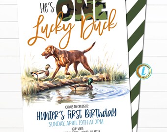 May include: A birthday invitation with the text "He's One Lucky Duck." The design features a brown dog, ducks, and a pond scene. The invitation includes the text "Hunter's First Birthday" and event details.