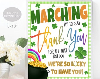 May include: A printable 8x10 inch sign with a green shamrock border and a rainbow. The sign says "Marching by to say Thank You for all that you do! We're so lucky to have you!"