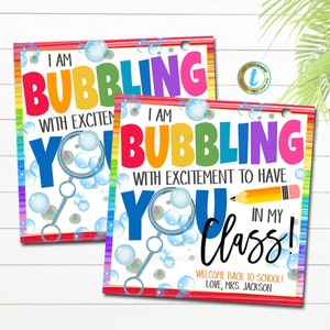 May include: Two colorful welcome back to school signs with a rainbow background and bubbles. The text on the signs reads "I am bubbling with excitement to have you in my class!" and "I am bubbling with excitement you".
