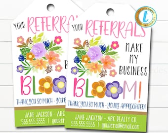 May include: Two floral-themed gift tags with the text "Your Referrals Make My Business Bloom!" and "Thank you so much - You're appreciated!"  The tags feature a watercolour-style floral design with pink, orange, yellow, and purple flowers. The text is in a pink, green, and blue font. The tags are on a white background.