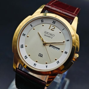 Vintage Seiko Quartz Men&#39;s Wrist Watch Day Date. Golden Plated watch