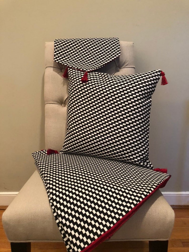 Modern black and white zigzag Christmas tree skirt with red trim