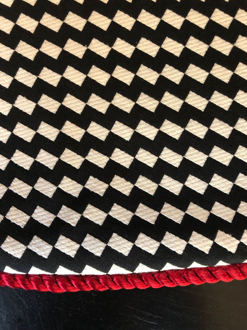 Modern black and white zigzag Christmas tree skirt with red trim