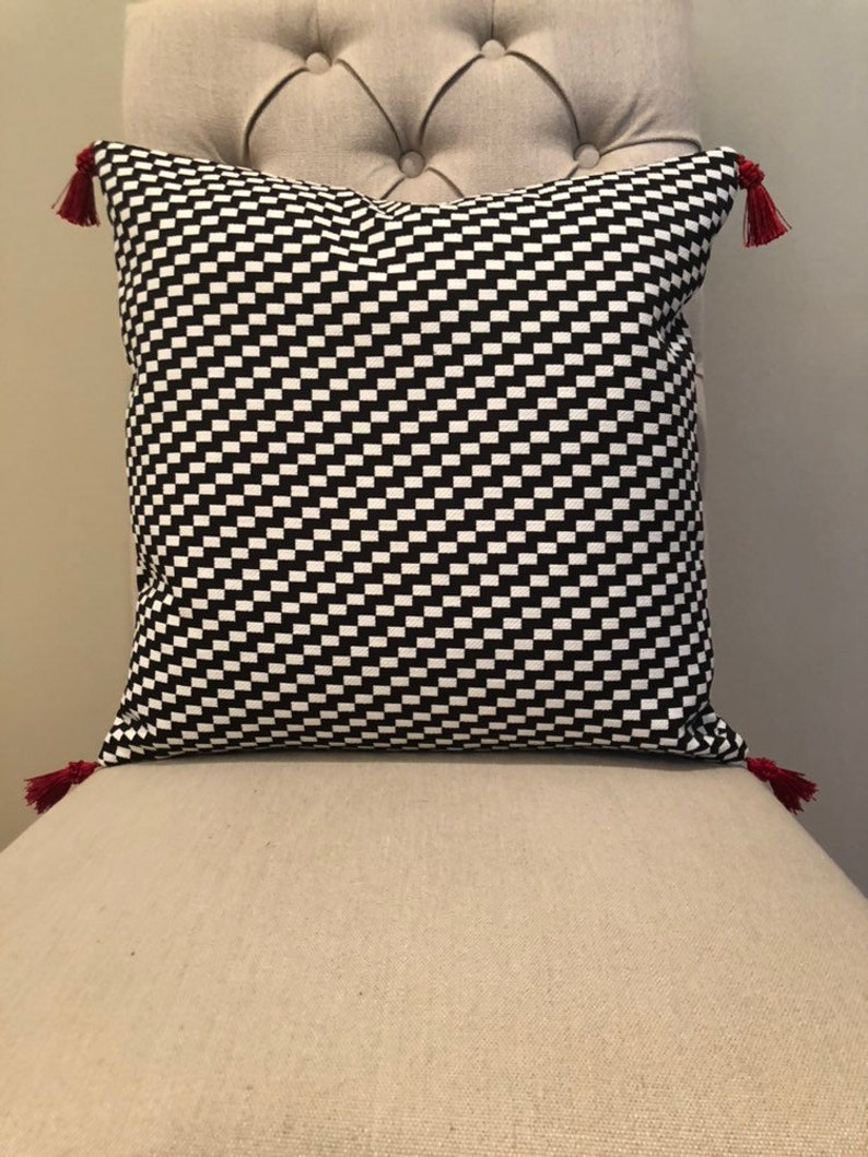 Modern black and white zigzag Christmas tree skirt with red trim