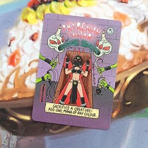 May include: A purple card with the text "PHYREXIAN ALTAR" and "ARTIFACT". The card features a cartoon illustration of a figure on a wooden structure, surrounded by green hands holding weapons. The text "SACRIFICE A CREATURE: ADD ONE MANA OF ANY COLOUR" is at the bottom.