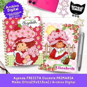 May include: Two spiral-bound notebooks featuring illustrations of a character with a strawberry hat. The left notebook has a red background with strawberries and the text 'Profesora Elizabeth'. The right notebook shows the character near a fence.