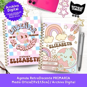 May include: Two spiral-bound notebooks with colourful, retro-style designs. One features a heart and floral design with the text "Enseñar es un trabajo de corazón". The other has a rainbow and globe design. A pen and star-shaped paper clips are also visible.