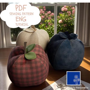 May include: Three fabric fruit decorations: a red and black checked apple, a beige pumpkin, and a navy blue berry with star stitching. The image includes the text "PDF SEWING PATTERN ENG TUTORIAL".