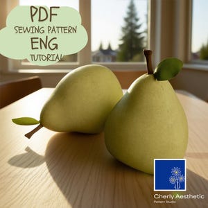 May include: Two light green pear-shaped objects with brown stems and green leaves sit on a wooden table. The image includes text that reads "PDF SEWING PATTERN ENG TUTORIAL" and a logo for "Cherly Aesthetic Pattern Studio."