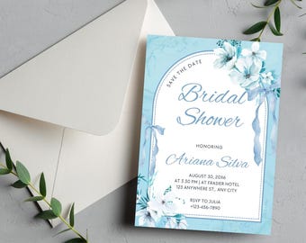 May include: A light blue bridal shower invitation card with a white arched frame, watercolor white flowers, and blue ribbons. The text reads: SAVE THE DATE, Bridal Shower, HONORING Ariana Silva, AUGUST 30, 20X6, AT 3.30 PM, AT FRASIER HOTEL, 123 ANYWHERE ST., ANY CITY, RSVP TO JULIA, 123-456-7890.