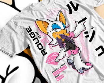 May include: White t-shirt with a cartoon illustration of Rouge the Bat. The design includes pink accents, Japanese text, and the words "Dazzling Emerald Bat Kiss."